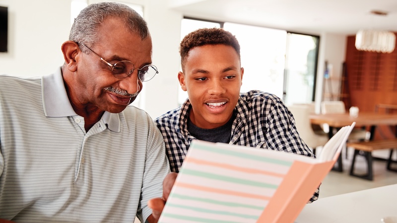 A veteran shares his legacy of military service with his grandson. Image from Shutterstock
