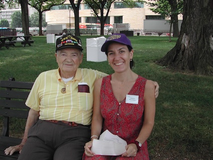 A veteran and his granddaughter on a bench after he has shared his legacy of family service with the LOC