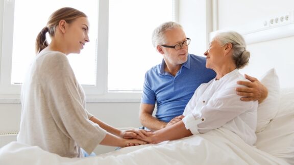 A woman in bed because of a stroke