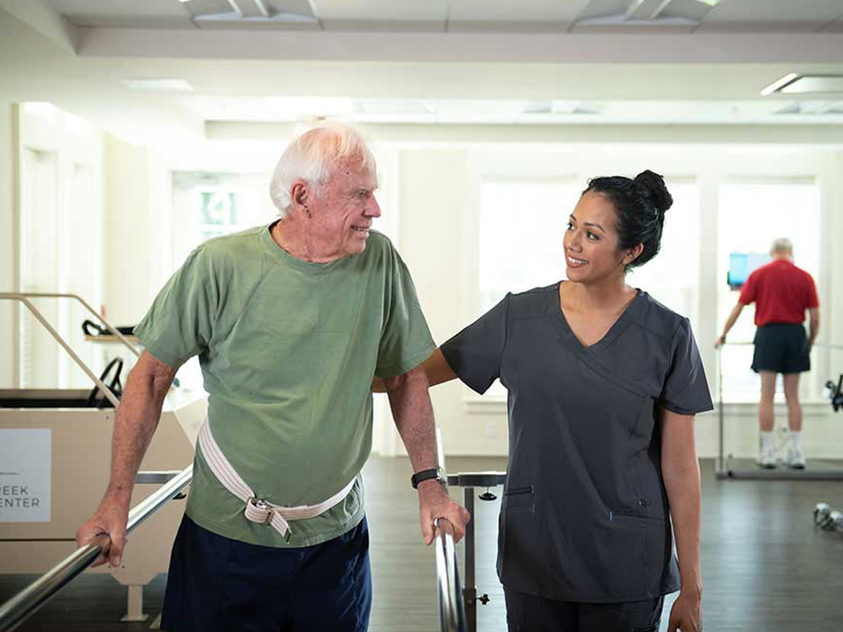 Briar Creek at the Barclay Caregiver with Man at Rehab