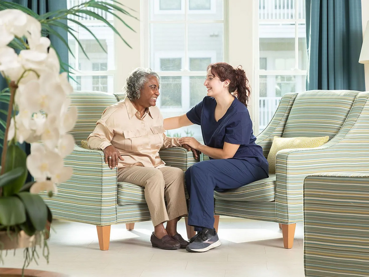 Bloomsbury at Hayes Barton Place Caregiver Talking to Lady