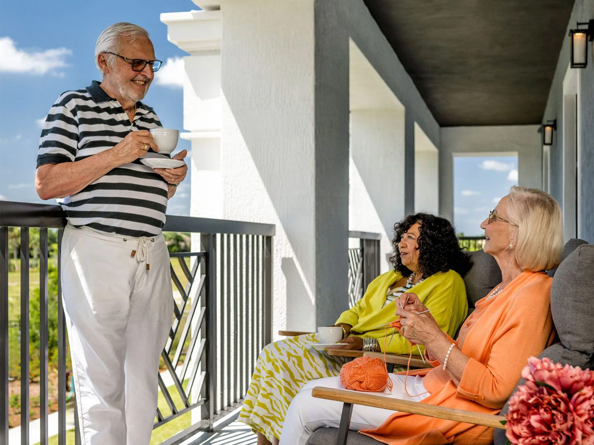 Lisbet at Wellington Bay Friends on Balcony Enjoying Coffee