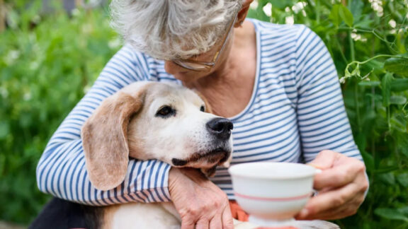 The Landings of Kaukauna Lady Hugging Dog