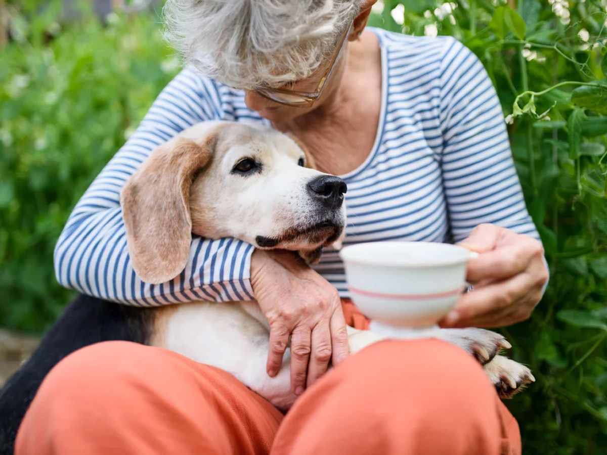 The Landings of Kaukauna Lady Hugging Dog