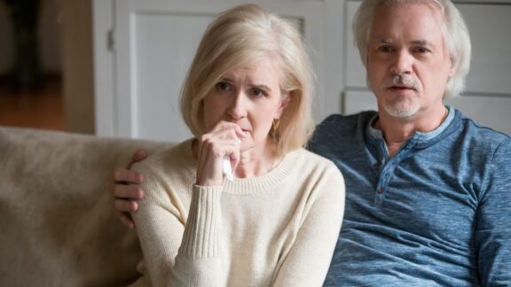 Couple emotional because of clutter.