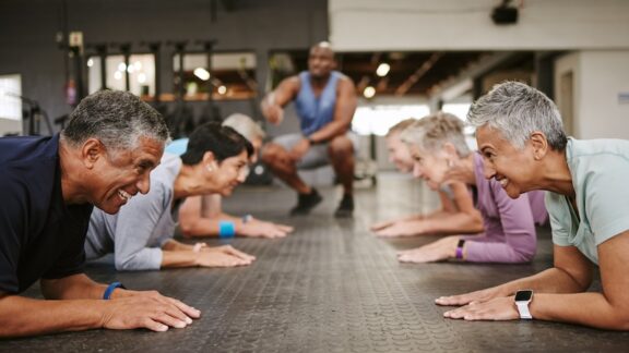 Seniors in a class workout, demonstrating ways to mind your heart and have a happier, longer life.