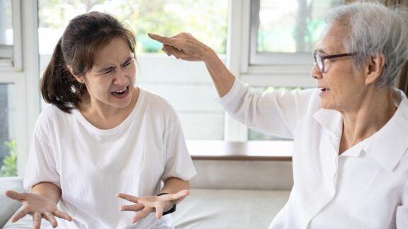 Mother and daughter fighting because the mother resents her daughter's help.