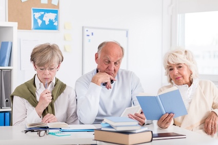 A group of seniors studying since they're excited about lifelong learning.