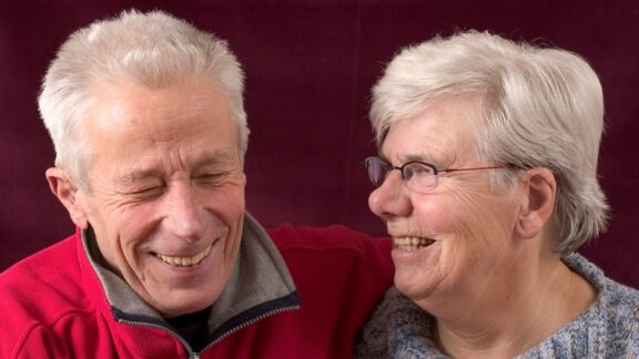 A happy laughing older couple, aware of the potentially harmful changes of aging. Simone Van Den Berg