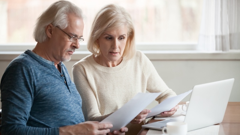 A newly retired couple considers budgeting in retirement. Fizkes