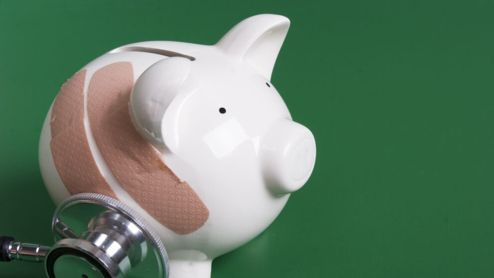 A piggy bank with band-aids and a stethoscope representing Medicare mistakes.