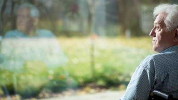 basics of worry: man in a wheelchair stares away. bialasiewicz