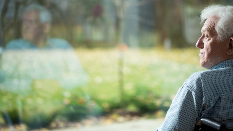 basics of worry: man in a wheelchair stares away. bialasiewicz