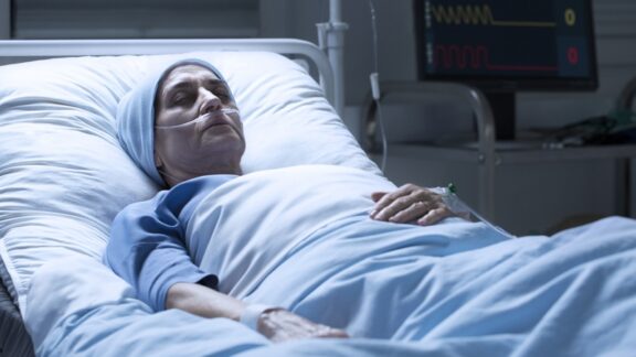 A woman in a hospital bed. This dying friend refuses contact.