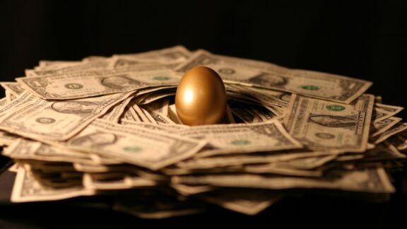 A golden egg in the middle of money representing a 401k loan