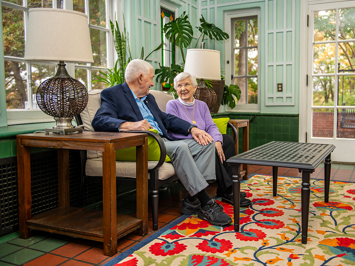 Hermitage Roanoke Couple Sitting in Sunroom