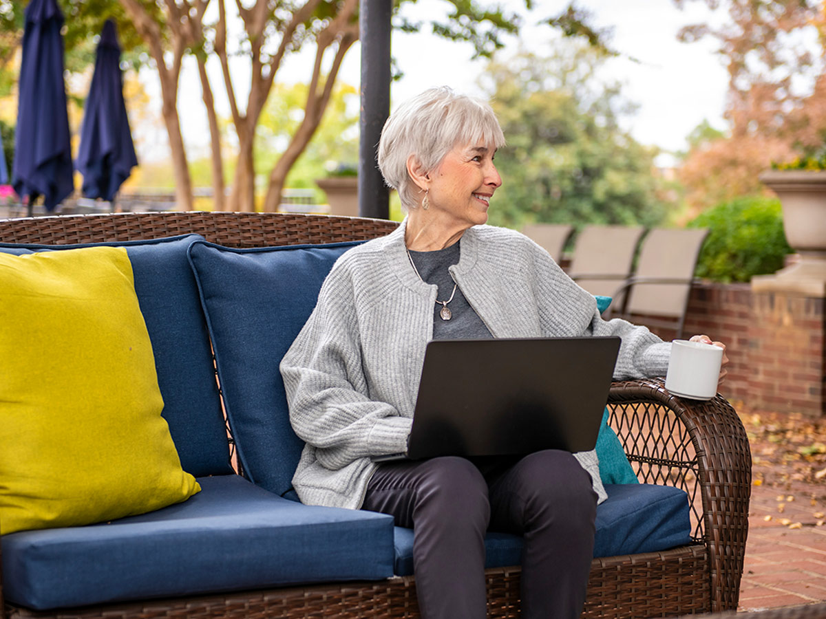 Hermitage Roanoke Lady Outside with Laptop