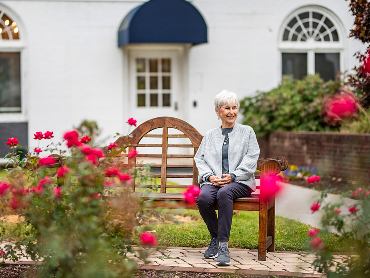 Hermitage Roanoke Lady Sitting on Outside Bench