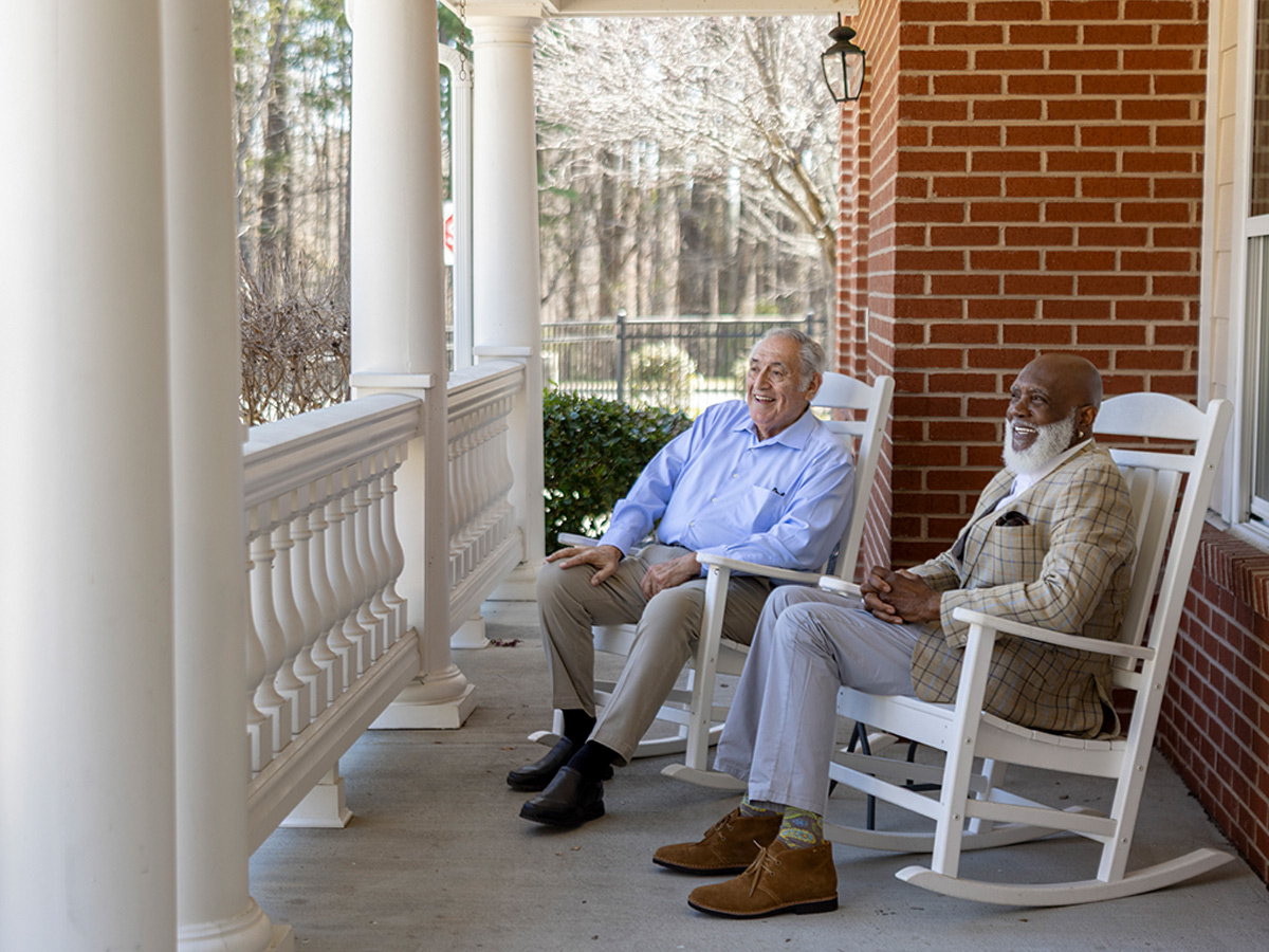 Hermitage Three Chopt Friends Outside Sitting in Rocking Chairs