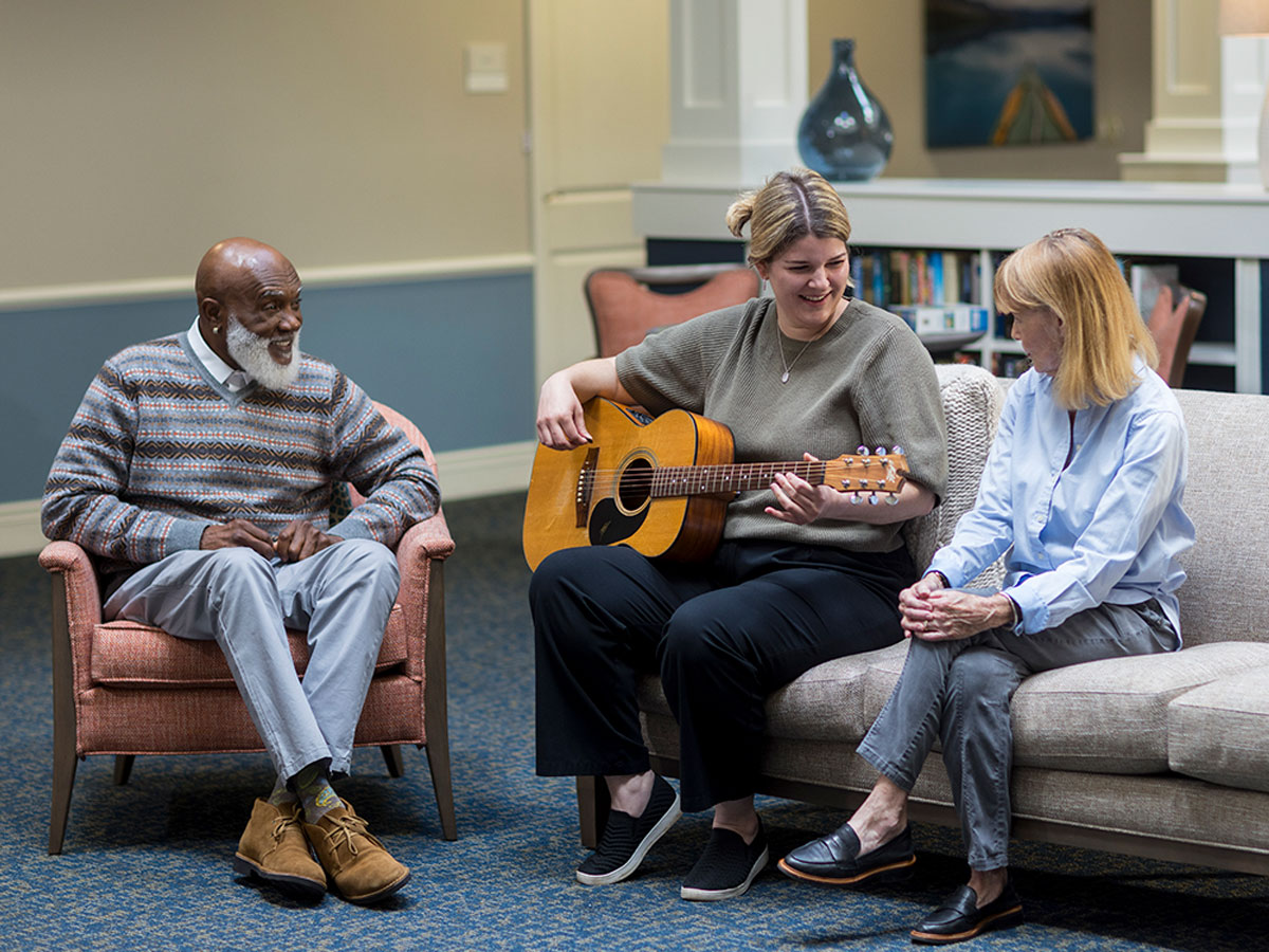 Hermitage Three Chopt Lady Playing Guitar