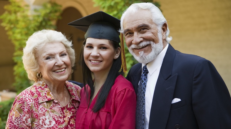 grandparents with their new graduate granddaughter wonder about the best gifts for graduates. Photographerlondon
