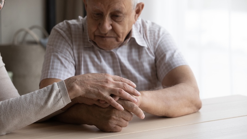A trouble elderly man with dementia delusions and wife trying to comfort him. Fizkes