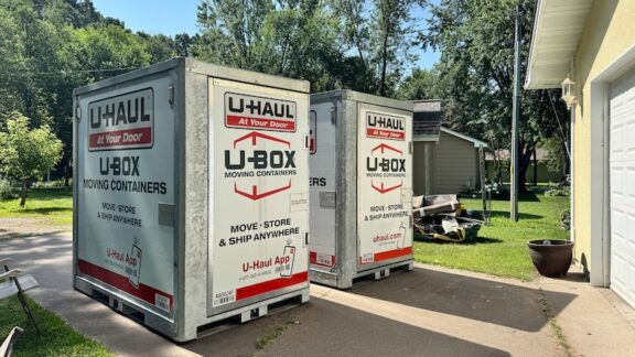 Two moving crates in front of a garage. Should You Move to a Low-Tax State?