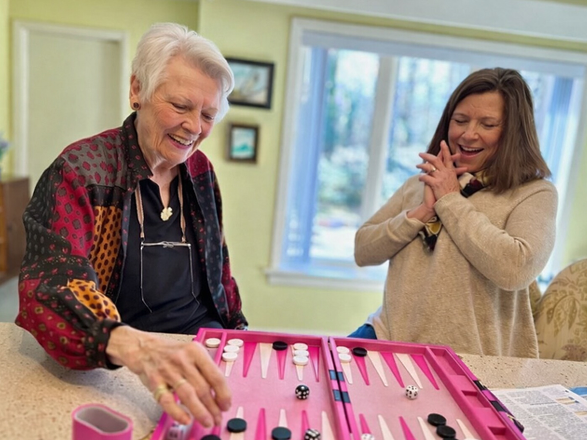 Naborforce Senior Lady and Friend Playing Backgammon