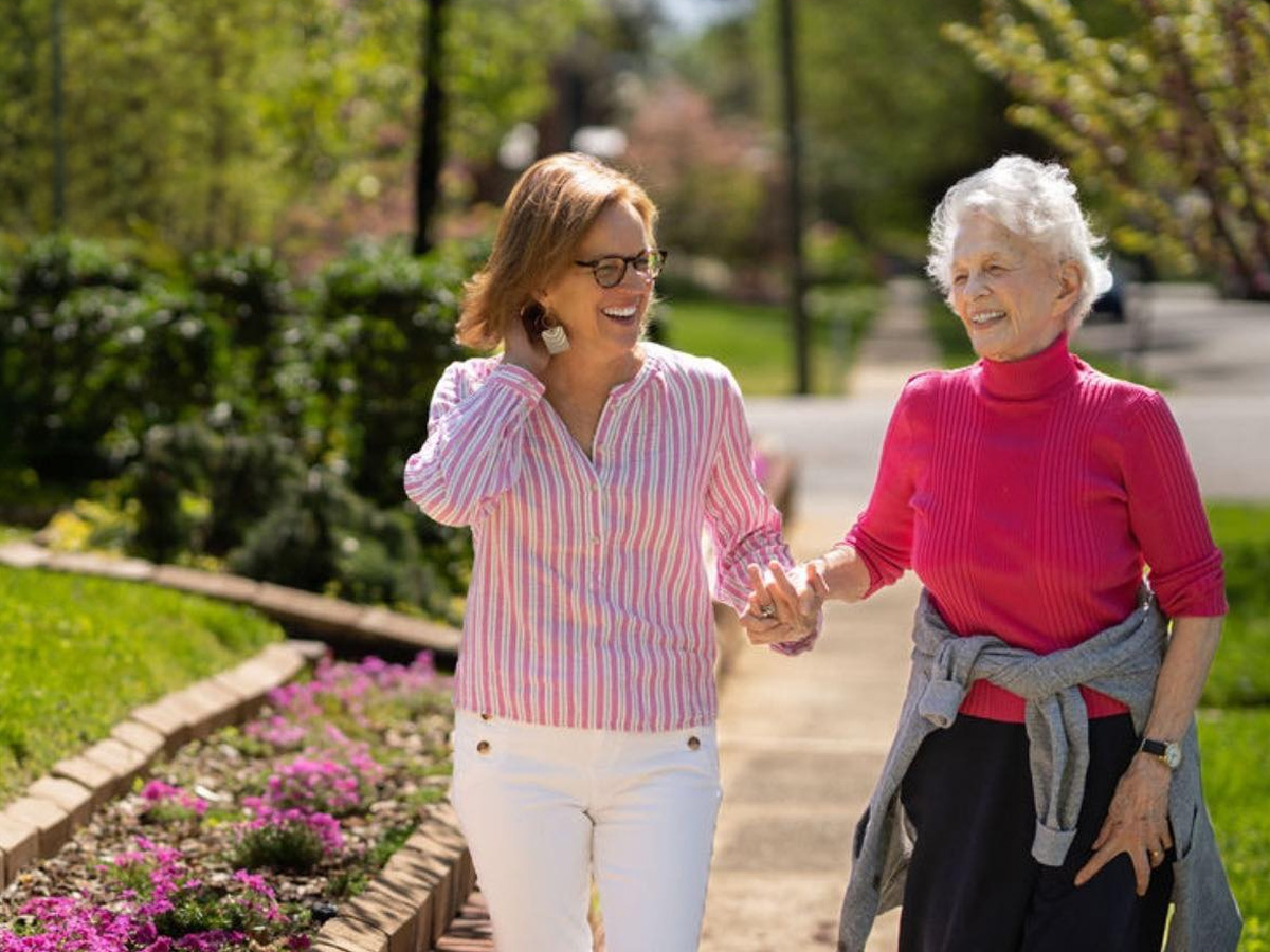 Naborforce Senior Lady and Friend Walking Outside