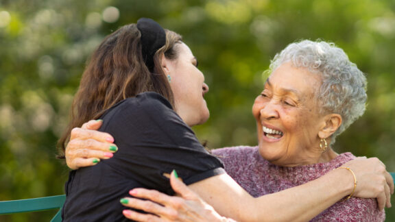 Naborforce Senior Lady Hugging Friend