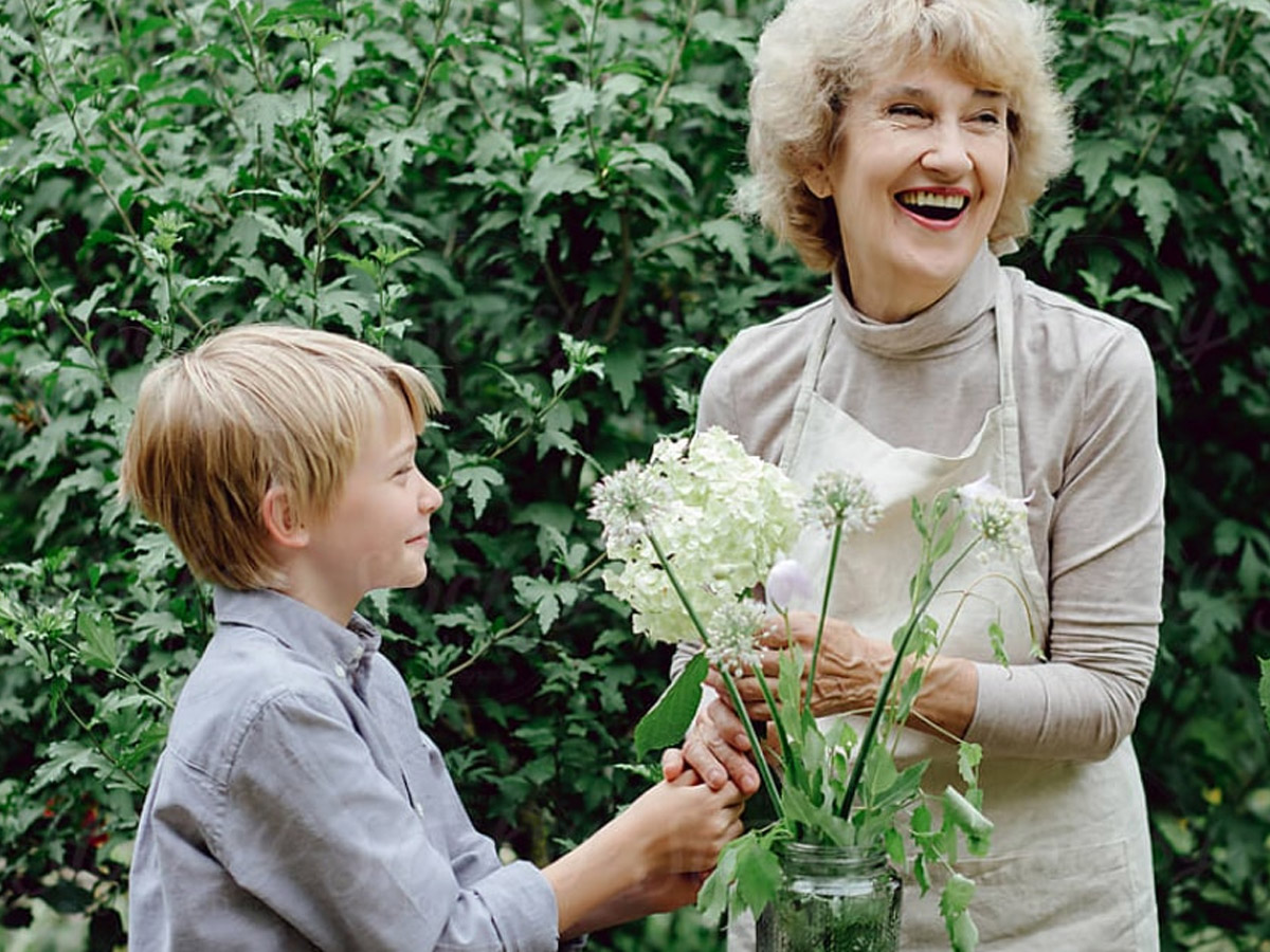 Maplewood at Danbury Grandma with Grandson Holding Flowers