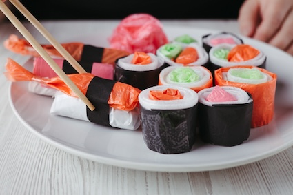 Artificial sushi set made of plastic bags and litter, illustrating marine plastic pollution and how people may consume it, too. 