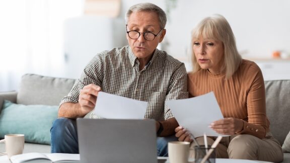 A senior couple on a computer learning of Medicare changes