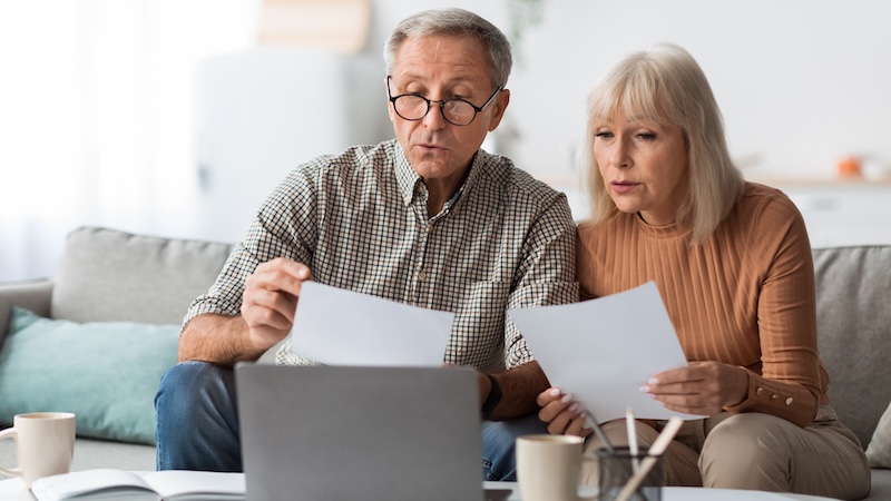 A senior couple on a computer learning of Medicare changes