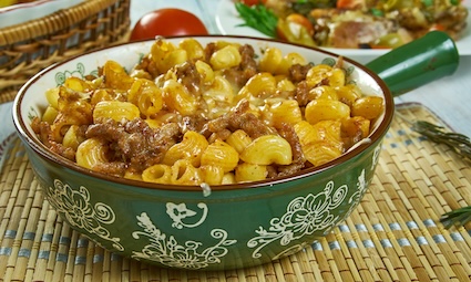 Johnny Marzetti, pasta dish consisting of noodles, cheese, ground beef, and a tomato sauce , Italian-American cuisine, Traditional assorted dishes, Top view. An iconic Ohio food.
