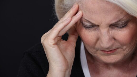 A sad woman experiencing delayed grief