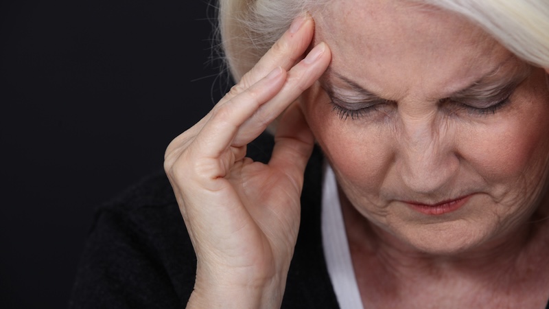 A sad woman experiencing delayed grief