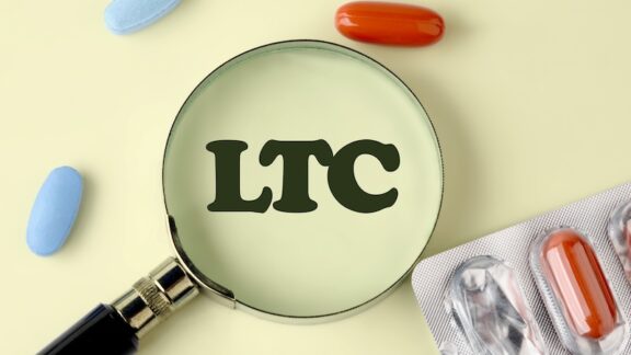A magnifying glass on LTC, standing for long-term care insurance