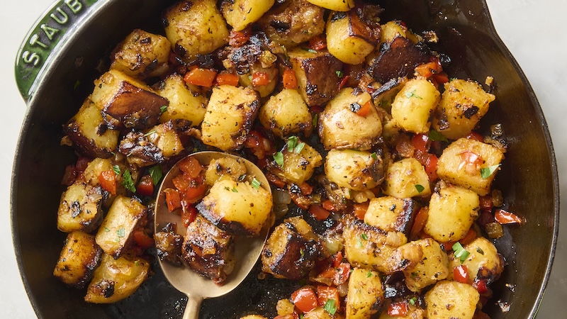 Country potatoes in a wooden serving bowl ready to eat.