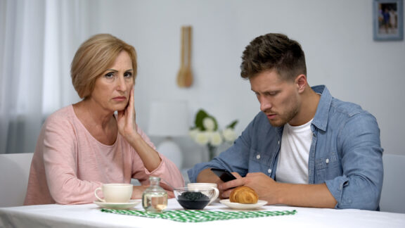 A mother irritated at son since she's ready to downsize but he doesn't want to move.