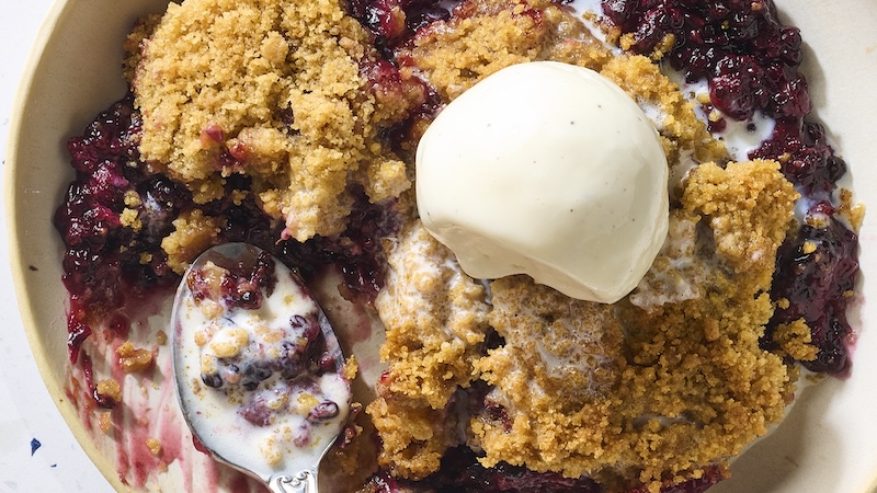 blackberry crumble with ice cream on top.