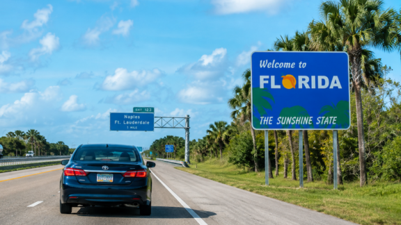 Parents in a car moving to Florida which caused family conflict.