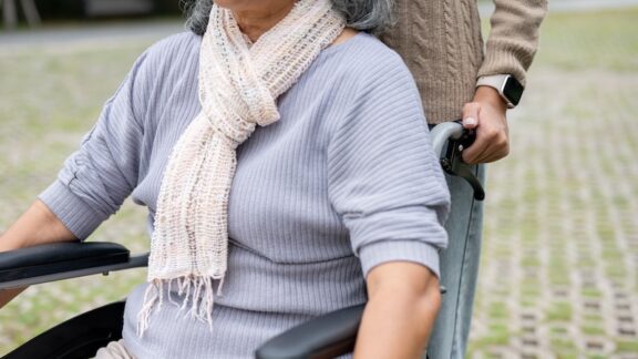 A daughter with her senior mother getting paid as caregiver.