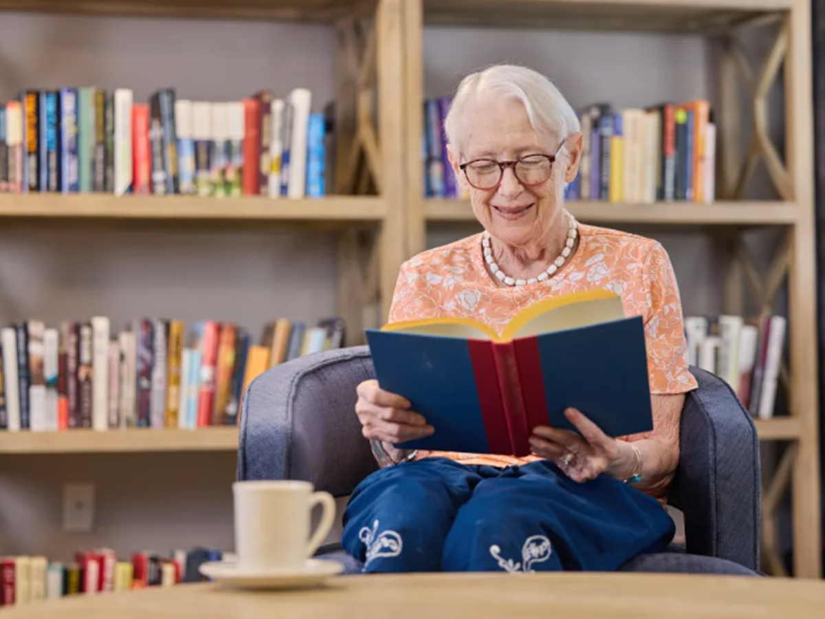 Lighthouse Pointe Lady Reading Book
