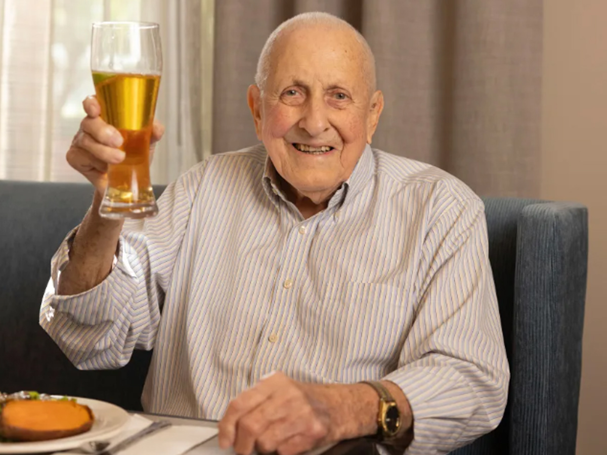 Lighthouse Pointe Man Holding Beer Glass