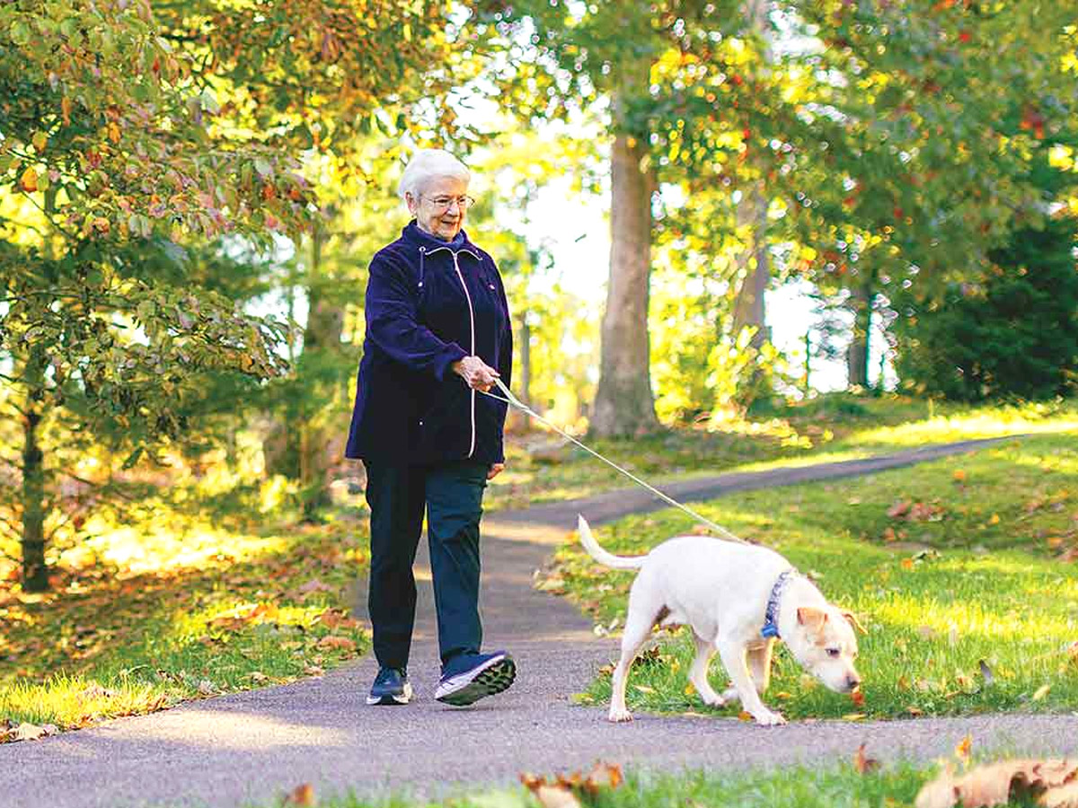 Brandon Oaks Lady Walking Dog