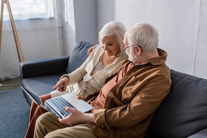 A couple planning their a trip, realizing they aren't stuck at home despite his physical challenges