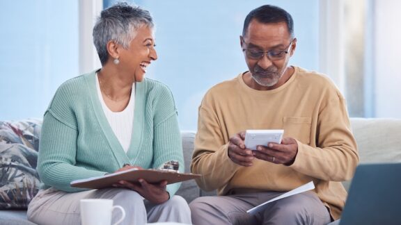 A couple strategically making a financial check list