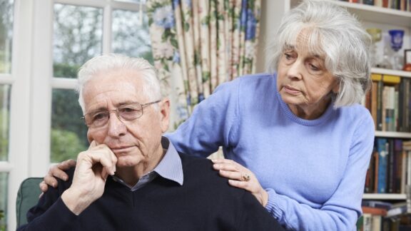 If you suspect a loved one has dementia, like this woman looking with concern at her husband, it's important to act. Ian Allenden