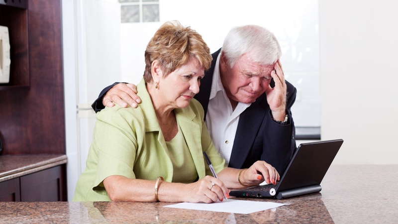 A couple looking at a computer, worried about the 2027 Social Security COLA. Michael Zhang